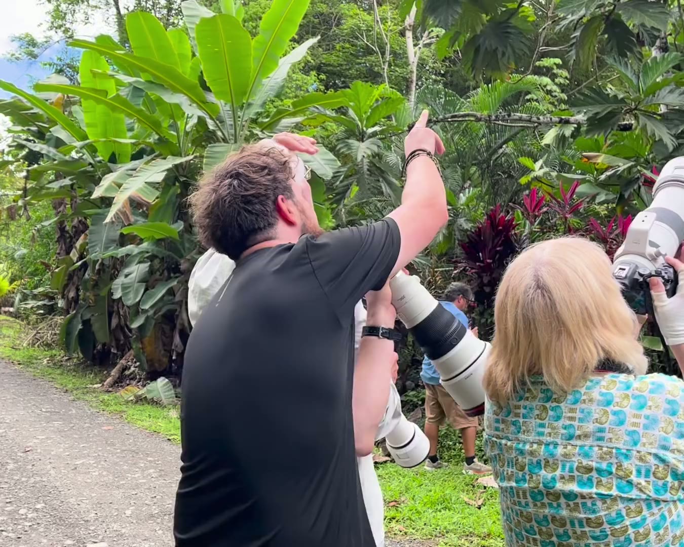 Charlie pointing out wildlife to a guest in the gardens
